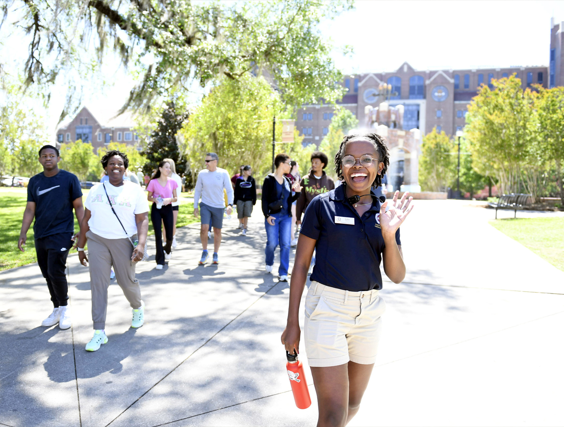 Picture of tour guide waving at FSU.